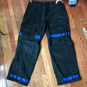 Girbaud jeans. Black with blue straps.
